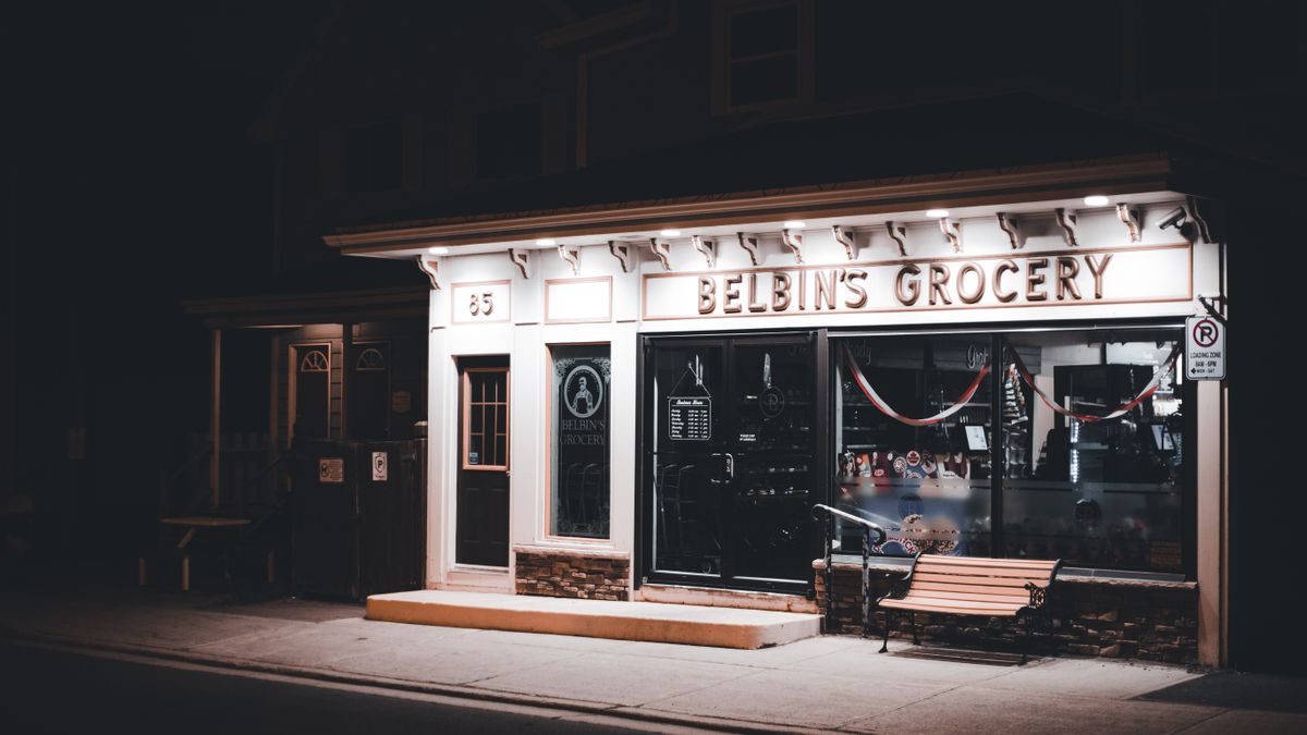 A warmly lit local small business storefront in the evening, representing the kind of Brisbane business that benefits from affordable local SEO. Photo from Pexels.